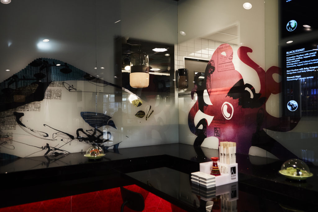 Unique brand graphics UV - printed on semi transparent glass dividers and panels.
