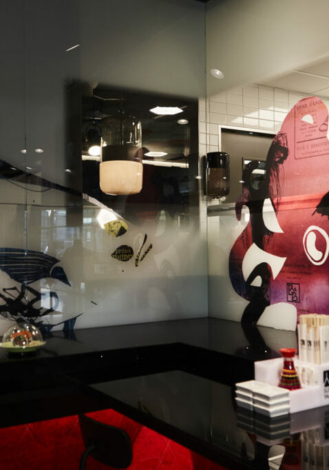 Unique brand graphics UV - printed on semi transparent glass dividers and panels.
